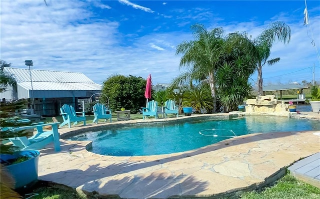 view of pool featuring a patio