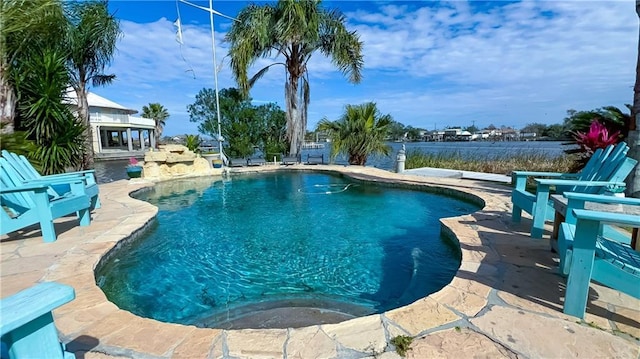 view of swimming pool with a patio