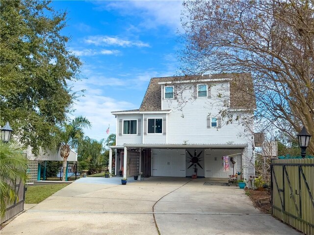 view of front facade with a garage and a carport