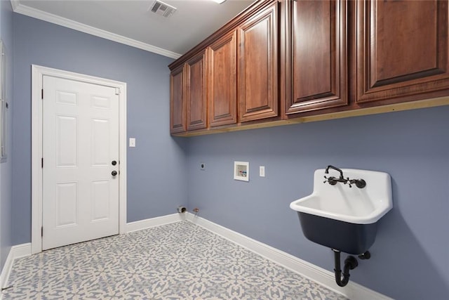 clothes washing area featuring crown molding, electric dryer hookup, hookup for a gas dryer, cabinets, and washer hookup