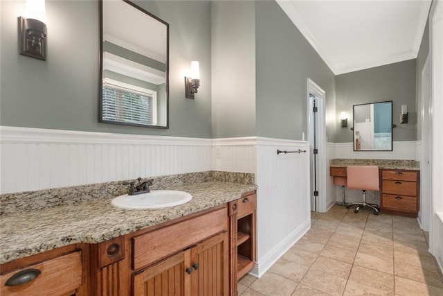 700 Dewey Ave, Slidell, LA 70458 - bathroom featuring vanity, crown molding, wainscoting, and tile patterned floors