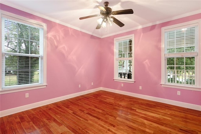 unfurnished room featuring hardwood / wood-style flooring, ceiling fan, and crown molding