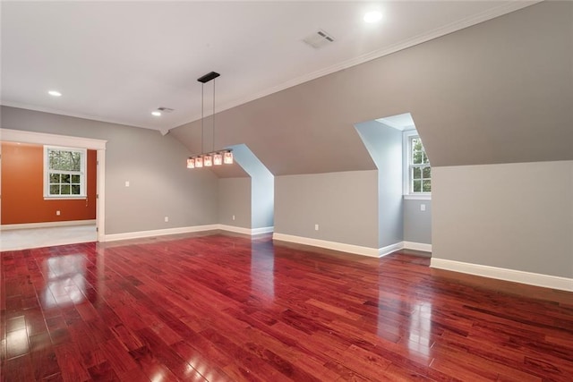 700 Dewey Ave, Slidell, LA 70458 - additional living space featuring vaulted ceiling, dark wood-type flooring, plenty of natural light, baseboards, and recessed lighting