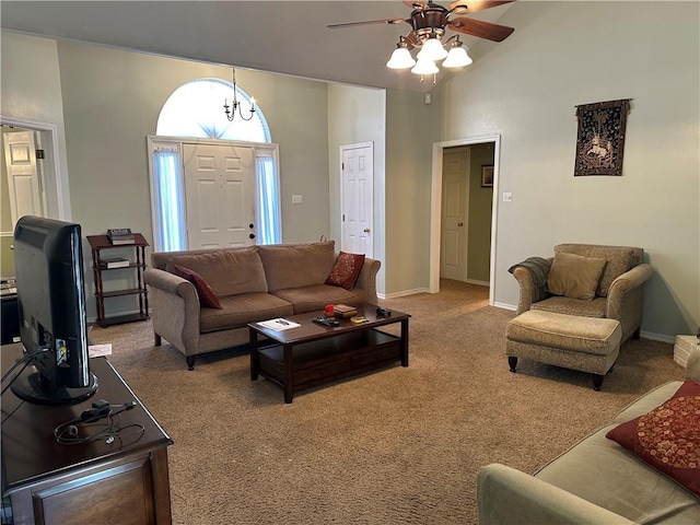 living room featuring ceiling fan with notable chandelier, high vaulted ceiling, and carpet flooring