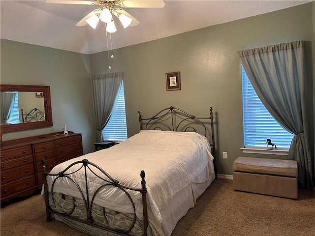 bedroom featuring ceiling fan, carpet, and lofted ceiling