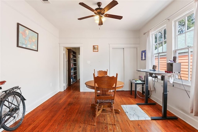 dining room featuring ceiling fan and wood-type flooring