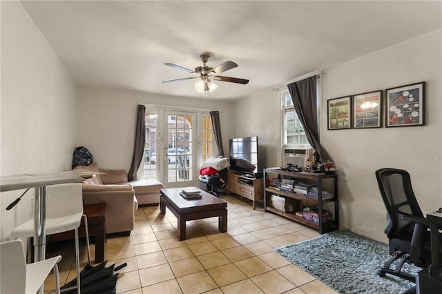 living area featuring ceiling fan, cooling unit, and light tile patterned floors