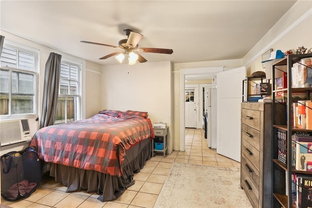 tiled bedroom with white refrigerator, cooling unit, and ceiling fan