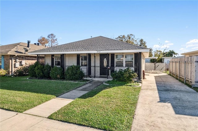 bungalow with a front yard