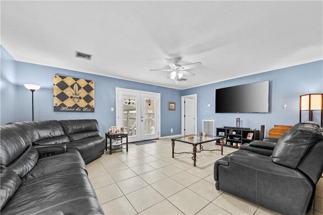 living room featuring french doors, ceiling fan, ornamental molding, and light tile patterned floors