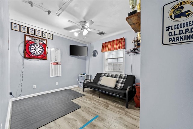 interior space with ceiling fan and light hardwood / wood-style floors