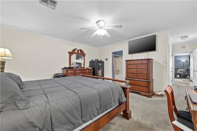 carpeted bedroom with crown molding and ceiling fan