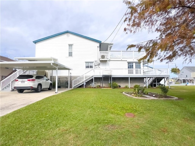 back of property featuring a carport, a yard, driveway, and stairs