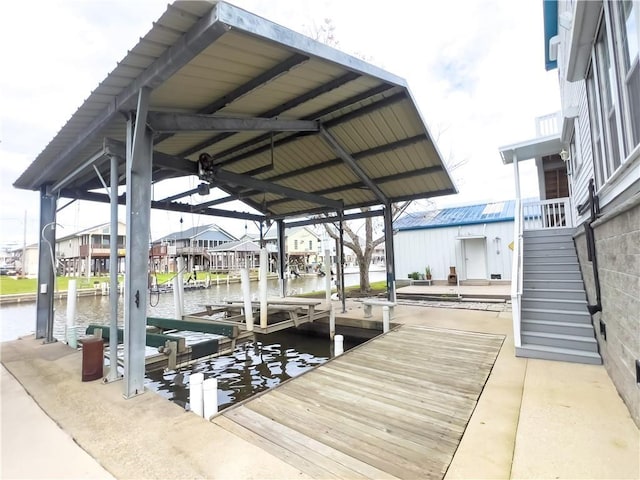 dock area with a water view and stairs