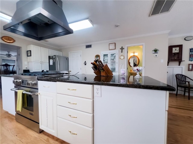 kitchen featuring visible vents, appliances with stainless steel finishes, extractor fan, crown molding, and white cabinetry