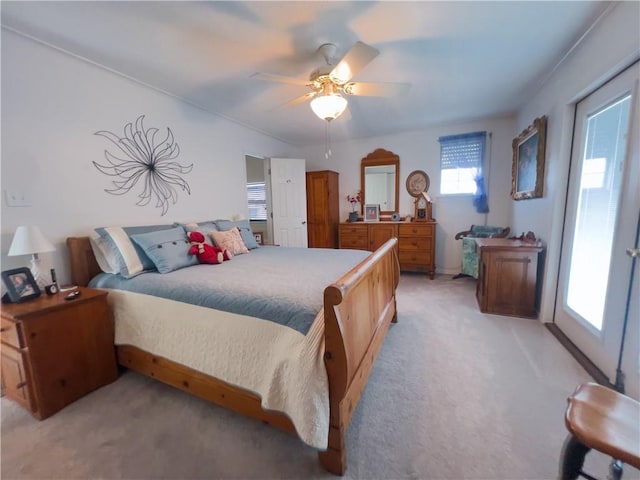 bedroom featuring ceiling fan and light colored carpet