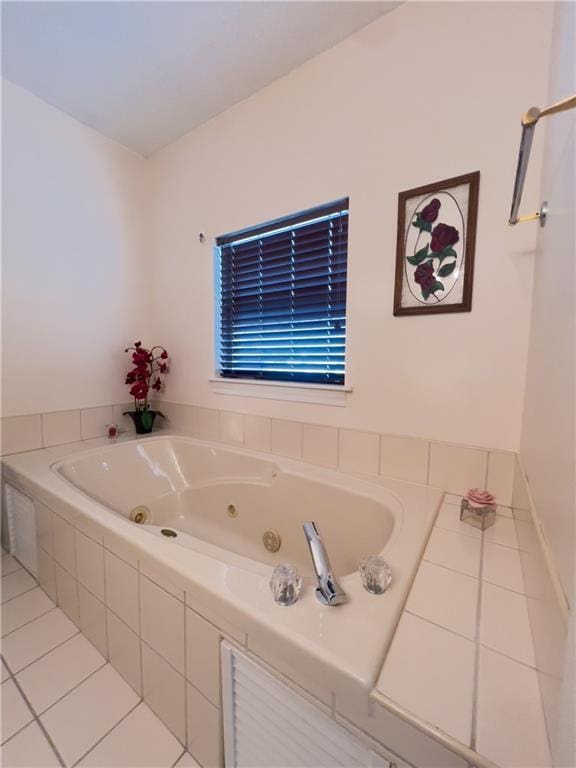 full bathroom featuring a whirlpool tub and tile patterned flooring