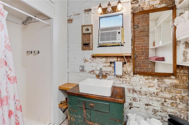 bathroom featuring vanity, brick wall, cooling unit, and walk in shower