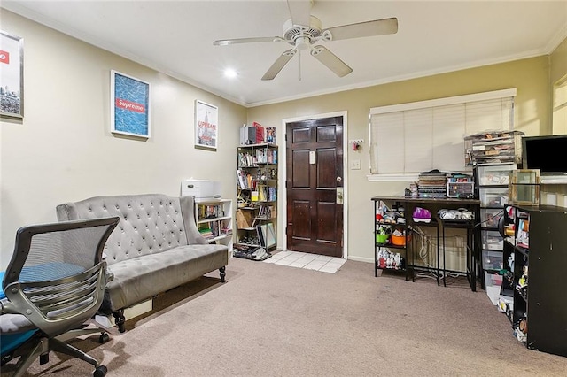 living area with ornamental molding, ceiling fan, and light colored carpet