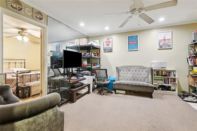 interior space featuring ceiling fan, carpet, and ornamental molding