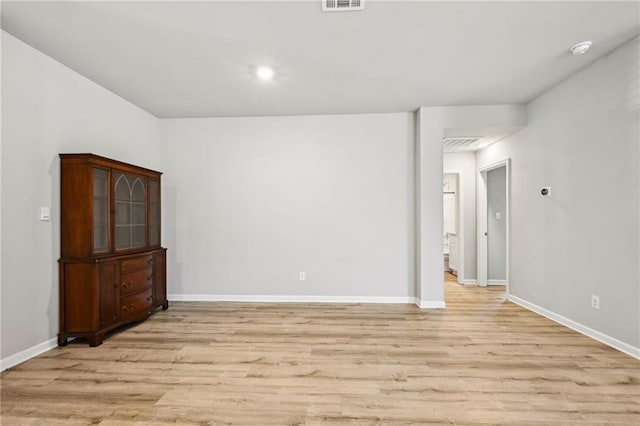 spare room featuring light wood-type flooring