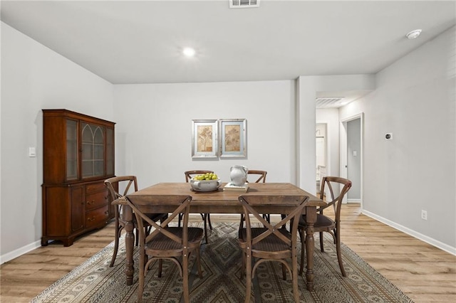 dining area with light wood-type flooring