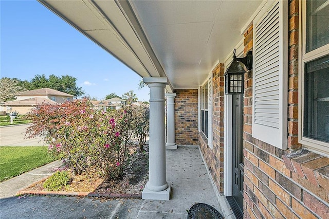 exterior space featuring brick siding