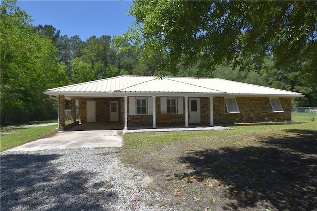 single story home featuring a carport