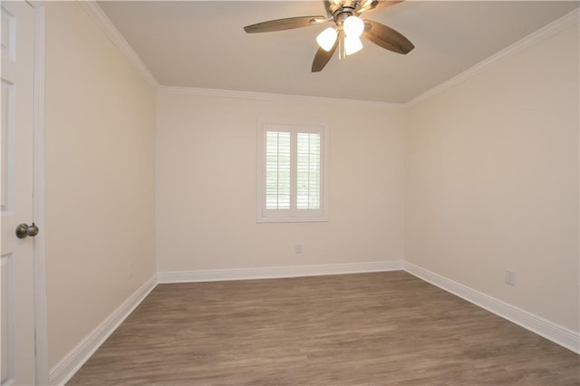 spare room featuring ceiling fan, ornamental molding, and dark hardwood / wood-style floors