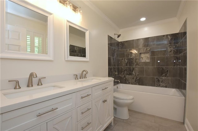 full bathroom with vanity, tiled shower / bath combo, ornamental molding, and toilet