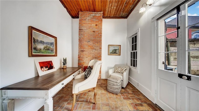 interior space with wood ceiling and ornamental molding