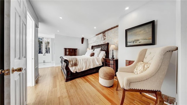 bedroom with hardwood / wood-style flooring