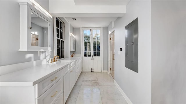 entryway featuring sink and electric panel