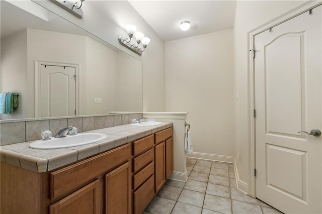 bathroom with vanity, tile patterned flooring, and decorative backsplash