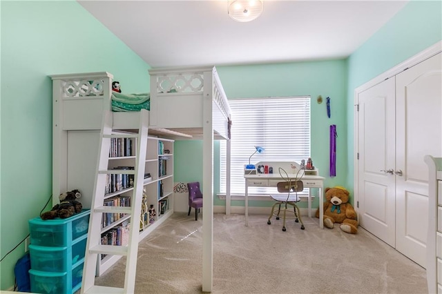 bedroom with light colored carpet and a closet