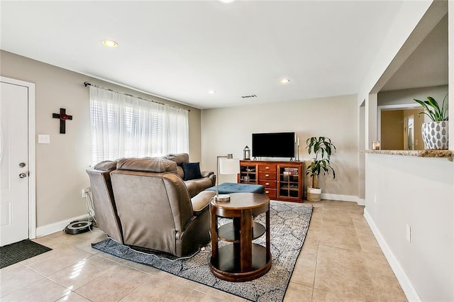 living room with light tile patterned flooring