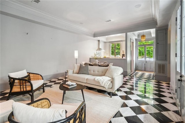 living room with a tray ceiling and crown molding