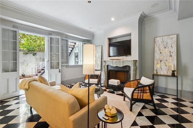 living room featuring ornamental molding and a premium fireplace