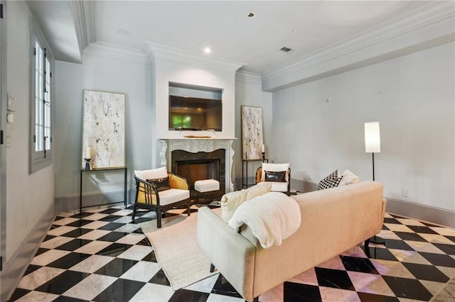 living room featuring ornamental molding and a premium fireplace