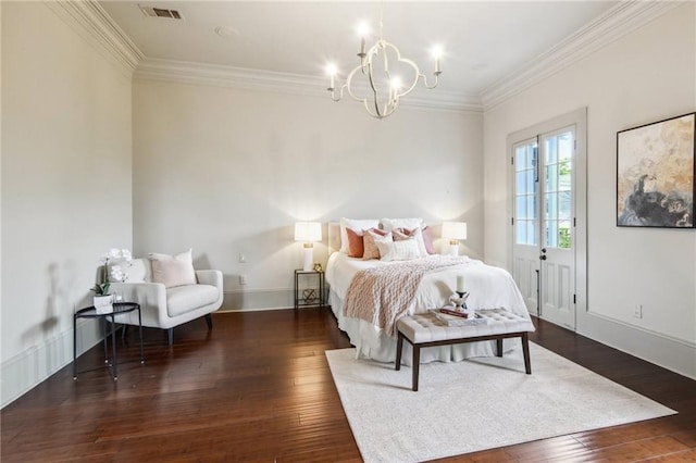 bedroom featuring a notable chandelier, ornamental molding, and dark hardwood / wood-style floors