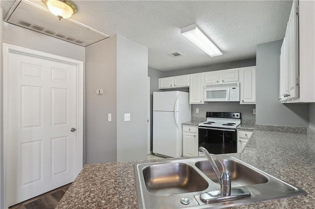 kitchen with white cabinetry, sink, a textured ceiling, and white appliances