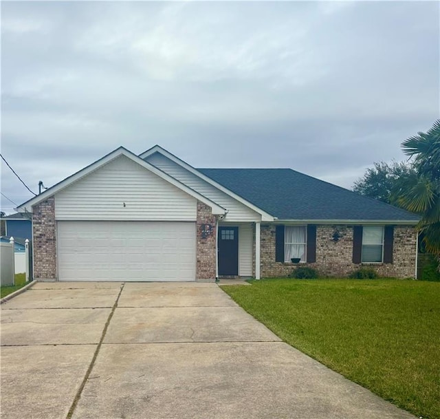 ranch-style home with a garage and a front lawn