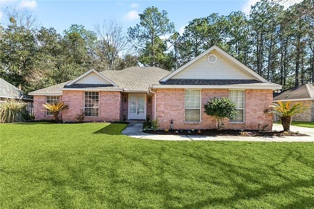 single story home featuring a front lawn