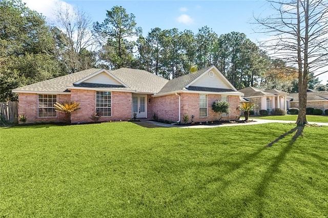 ranch-style house featuring a front yard