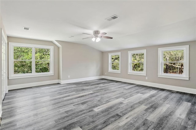 interior space with plenty of natural light, ceiling fan, and vaulted ceiling