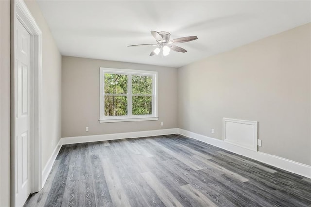 spare room featuring hardwood / wood-style flooring and ceiling fan