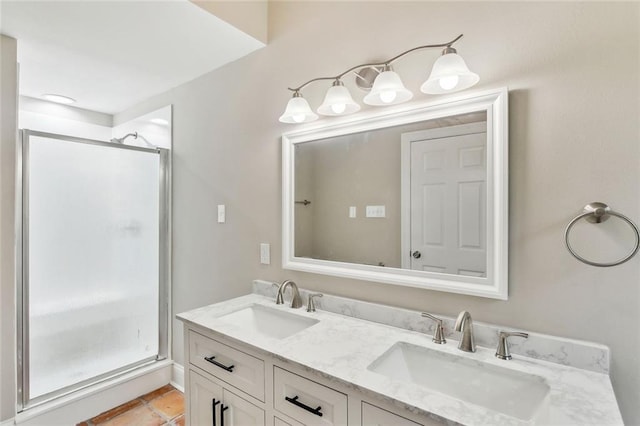 bathroom with a shower with door and vanity