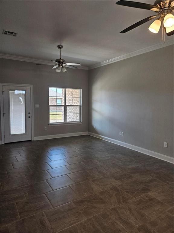 unfurnished room with baseboards, visible vents, a ceiling fan, and ornamental molding