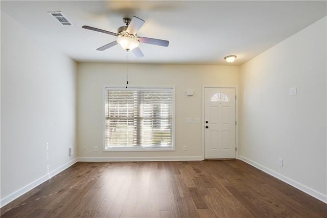 entryway with visible vents, dark wood finished floors, baseboards, and ceiling fan