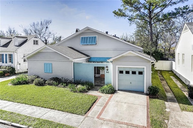 view of front facade with a garage and a front yard